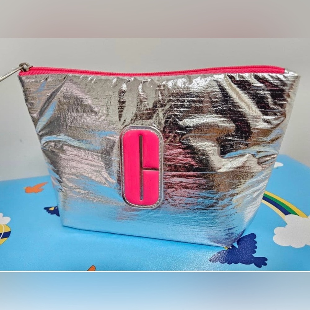 Clinique silver make up bag carrying case with zipper closure